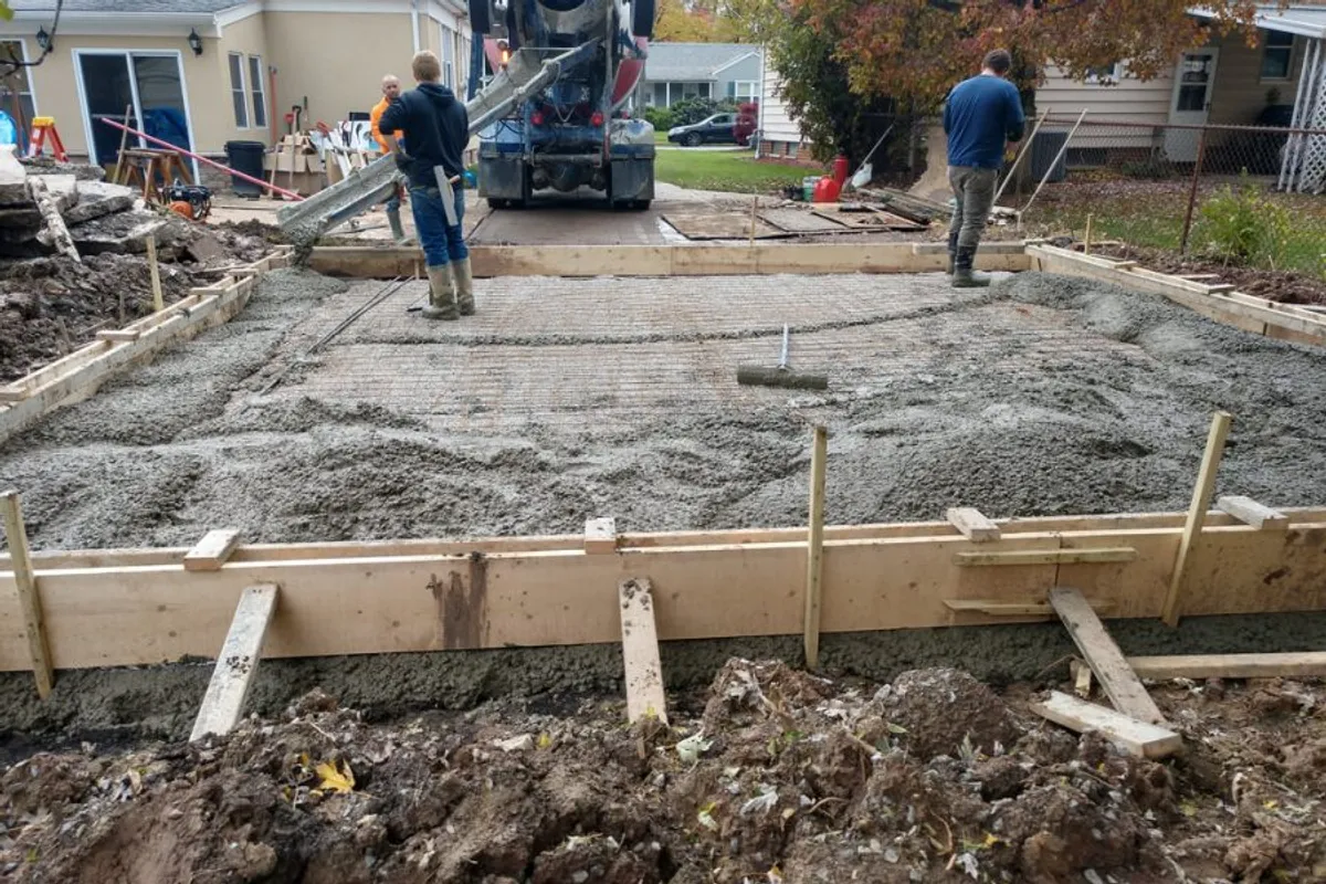 Concrete pour team installing a foundation slab in Murrieta, CA